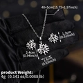 Macro detail of Tree of Life jewelry set with sparkling zircons held in black gloves - Silver Tree Branch (NS-J6557S)