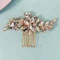 Detailed macro view of the rose gold hair comb with sparkling clear crystal floral design - Gold