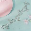 Close-up of silver bridal hair vine with marquise rhinestones and white pearls on blue back - HS-J7330S