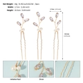 Detailed view of U-shaped hair pins featuring marquise zircon leaves and white imitation pearls - Gold