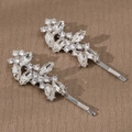 Elegant pair of leaf-shaped rhinestone hair clips with silver alloy base and clear crystals - HS-J7013S