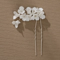 Detailed view of silver dual-prong hair stick with matte white ceramic flowers and rhinestones - Hs-j6680s