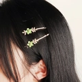Green floral enamel hair clips with white crystals on golden metal base for women - Green Enamel Flower Style (HS-J6526GREEN)