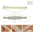 Macro detail of luxury bridal sash with intricate rhinestone floral patterns and satin ribbon - Silver