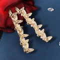 Eleganti fermagli per capelli a farfalla dorati con strass lucidi su sfondo blu scuro - HS-J6569G