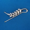 Elegant gold leaf hair clip with marquise-cut rhinestones on a navy textured background - HS-J6769G