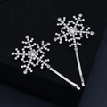 Elegant silver snowflake hair clips set with sparkling rhinestones on black background - HS-J4494
