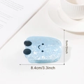 Pinza per capelli in acetato azzurro con trama marmorizzata e design smiley minimal - Fagiolo di Caramella Blu