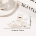 Transparent bow-shaped hair claw clip made of clear resin with golden metal spring - Clear