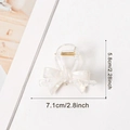 Elegant white 3D bow hair claw clip with pearlescent finish and dimensions 7.1cm x 5.8cm - White