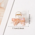 Elegant jelly-colored bow hair claw clip in translucent pink-orange pearlescent finish - Brown