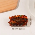 Tortoiseshell cat hair claw clip in amber texture with golden cat outline details - Amber