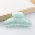 Elegant mint green marble acrylic hair claw clip with subtle gold glitter finish - Ice Blue
