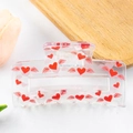 Molla per capelli rettangolare trasparente con motivi di cuori e ali rosse su vassoio - Stile Cuore con Ali (D19-1-3)