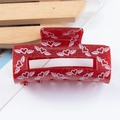 Sparkly red glitter acrylic hair claw clip featuring white winged heart patterns - Bright Red White Wings Style (C7-3-12)