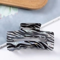 Elegant rectangular hair claw clip featuring black and white zebra stripes and pearl finish - Iridescent Zebra Print
