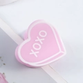Pink heart-shaped hair claw clip with white XOXO lettering and glossy resin finish - Pink (XOXO)
