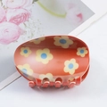 Vibrant orange floral Easter hair claw clip with colorful flower patterns for women - Orange Blue Core Floral