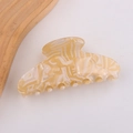 Large pale yellow resin hair claw clip with white marble texture and glossy finish - Amber Pattern