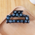 Rectangle hair claw clip with blue evil eye pattern on a black acrylic background - Black with Blue Eye (C19-4-9)