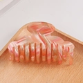 Pink and orange striped marble hair claw clip on a light wooden tray accessory - Orange White Striped Marble (C2-4-16)