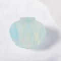 Elegant light blue seashell hair claw clip with golden glitter in translucent resin finish - Iridescent Blue