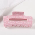 Pink rectangular hair claw clip with white XOXO letter pattern on a white background - Pink Base White XOXO (Large D18-2-1) / Large