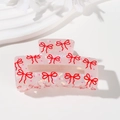 Pink pearlescent acrylic hair claw clip with red bow patterns and polka dots - Red Bow