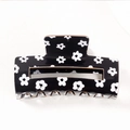 Large black hair claw clip with minimalist white flower pattern and glossy finish - Black Base White Floral Style (D22-4-21)