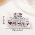 Rainbow PRIDE lettering on a white rectangular hair claw clip with colorful heart patterns - Dancing Rainbow Graffiti (D4-2-20)