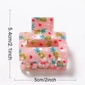 Pink hair claw clip with pineapple and heart patterns, dimensions 5.4cm by 5.0cm - 5cm / Pineapple
