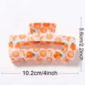 Large orange fruit pattern hair claw clip in glossy acrylic material 10.2cm width - 10.2cm / Orange