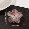 Pinza para el pelo flor rosa degradado con cristal rojo sobre fondo de madera - Marrón transparente