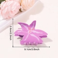Purple lily flower hair claw clip with elegant petal details on silk background - Purple