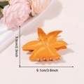 Elegant orange lily flower hair claw clip with realistic resin petal texture and dimensions - Orange