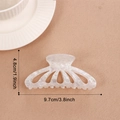 Elegant pearlescent white hollow hair claw clip with subtle glitter finish - Iridescent White