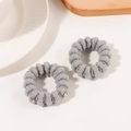 Set of two grey plush hair scrunchies with metallic charms for winter styling - Gray