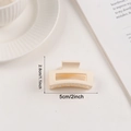 Minimalist cream matte square hair claw clip, 5cm size shown on decorative plate - Cream (d28)