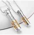Detail view of silver and gold capsule pendants with crystal and 'only' engraving - Large Gold / Ball Chain