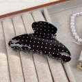 Vintage black hair claw clip with white polka dots in a glossy resin finish - Black Polka Dot