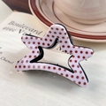 Pink star-shaped hair claw clip with red polka dots on vintage book background - Large Claw Clip / Pink Polka Dots