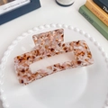 13cm acetate rectangle hair claw clip with tricolor marble pattern on a ceramic dish - Rock Brown