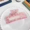 Pink marble texture acetate hair claw clip with rectangular design on a white decorative plate - Metallic Pink