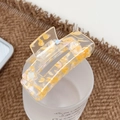 Square acrylic hair claw clip with golden flakes shown on a frosted glass - 7.5cm / Orange Yellow