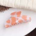 Orange and white cow print hair claw clip in glossy finish for french bun styles - Orange Cow Print