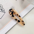 Tortoiseshell acetate hair clip in a water drop shape with hollow center and metal base - Teardrop Beige Tortoiseshell