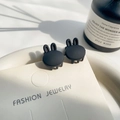 Mini matte black bunny hair claw clips for kids on a white jewelry display card - Black Rabbit