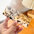 Classic tortoiseshell acetate wide-tooth hair comb held by hand for easy styling - 13cm / Beige Tortoise Shell