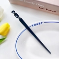 Minimalist black acetate hair stick with unique spiral twist design for stylish buns - Black / 17.5cm