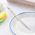 Minimalist cream-colored acetate hair pin with spiral twist design for buns - Off White / 17.5cm